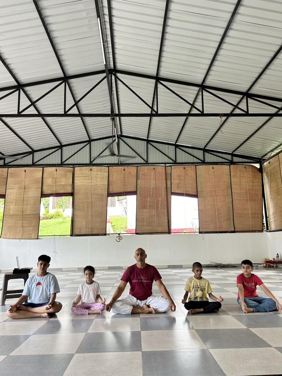 Peaceful ashram grounds at dawn — School of Hatha Yoga